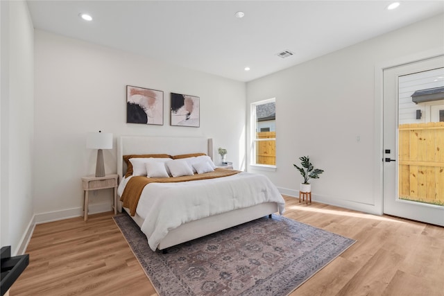 bedroom with light wood-style floors, baseboards, visible vents, and recessed lighting