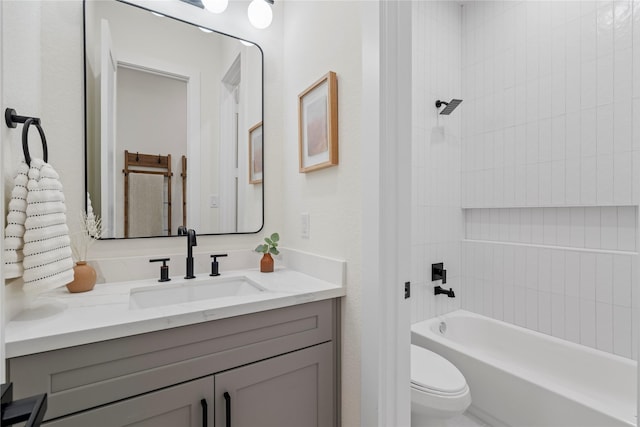 bathroom featuring shower / bath combination, vanity, and toilet