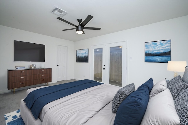 bedroom featuring light carpet, baseboards, visible vents, a ceiling fan, and french doors