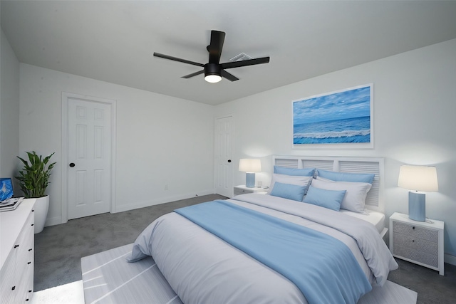 carpeted bedroom with baseboards and a ceiling fan