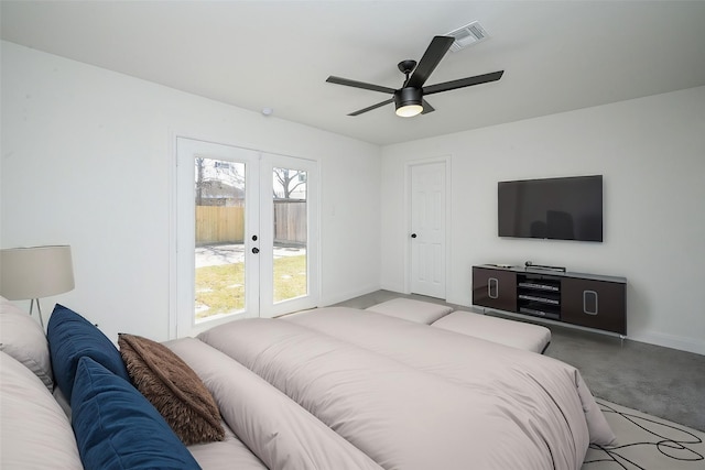 carpeted bedroom with baseboards, french doors, visible vents, and a ceiling fan