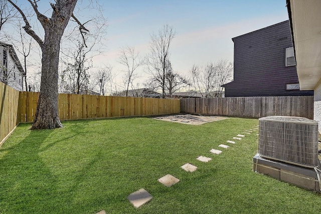 view of yard featuring a fenced backyard and cooling unit