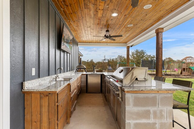 view of patio / terrace featuring ceiling fan, area for grilling, a sink, and a grill