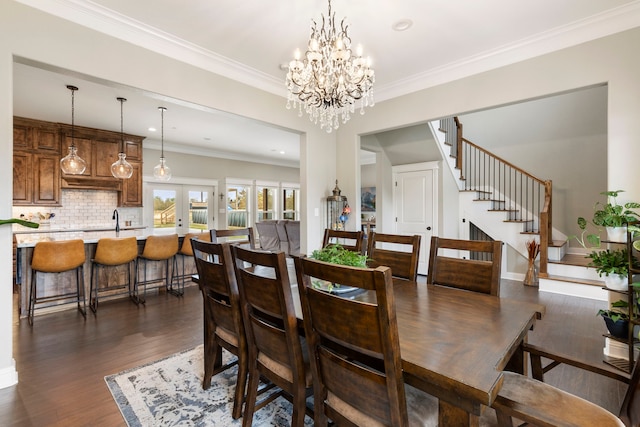 dining space featuring stairs, french doors, ornamental molding, dark wood-style floors, and an inviting chandelier