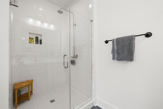 bathroom featuring a shower stall