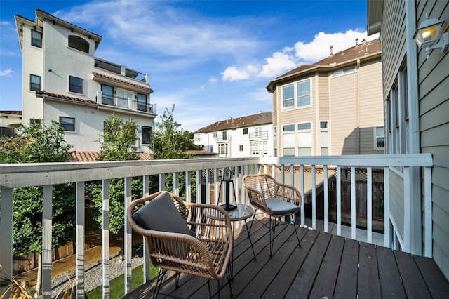 wooden deck with a residential view