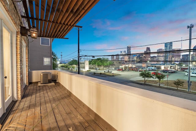 balcony featuring a city view and central AC