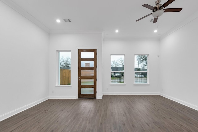 entryway featuring crown molding, dark wood-style flooring, and baseboards