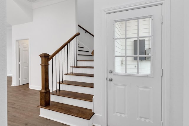 interior space with baseboards and wood finished floors