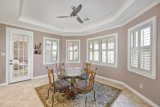 dining room featuring light tile patterned floors, baseboards, visible vents, and a raised ceiling