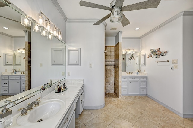 full bath with baseboards, visible vents, walk in shower, crown molding, and a sink