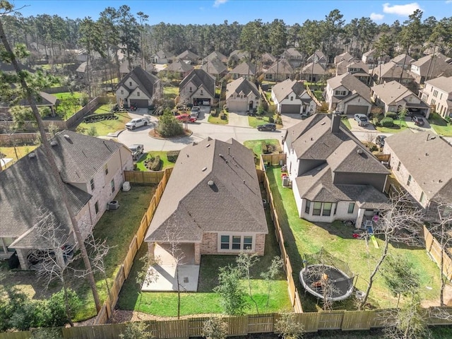 birds eye view of property with a residential view