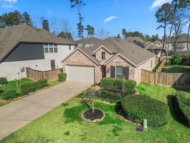 view of front of house featuring a garage, fence, concrete driveway, and brick siding