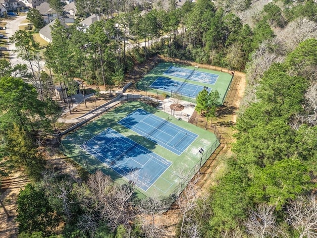 view of sport court featuring fence