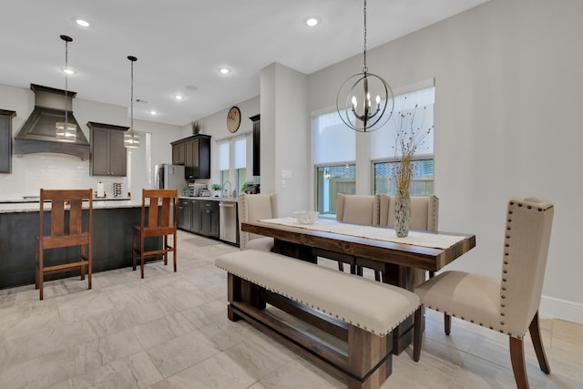 dining space with a notable chandelier and recessed lighting