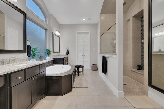 full bath with vanity, tiled shower, tile patterned flooring, and a bath