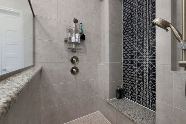 full bath featuring a tile shower