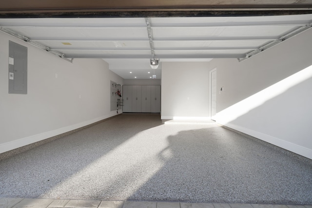 garage featuring electric panel, baseboards, and a garage door opener