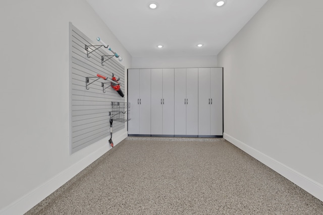 interior space featuring baseboards and recessed lighting