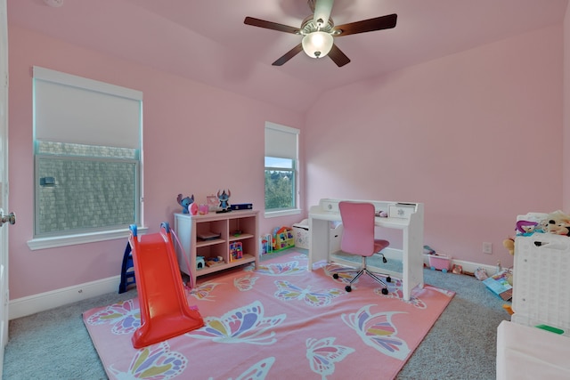 interior space with lofted ceiling, ceiling fan, carpet flooring, and baseboards