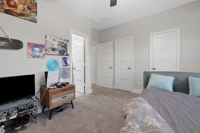 bedroom with baseboards, a ceiling fan, and carpet flooring