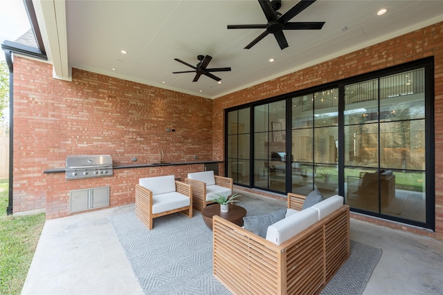 view of patio / terrace with outdoor lounge area, ceiling fan, a sink, and area for grilling