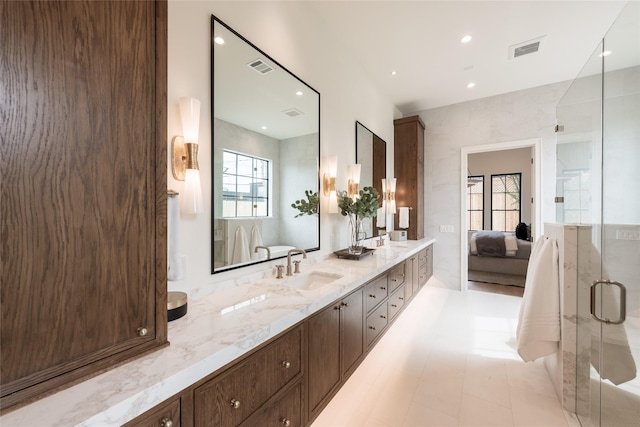 full bathroom with a sink, double vanity, ensuite bath, and visible vents