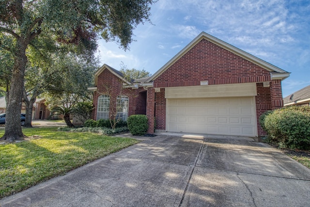 view of front of property featuring a garage, driveway, a front lawn, and brick siding