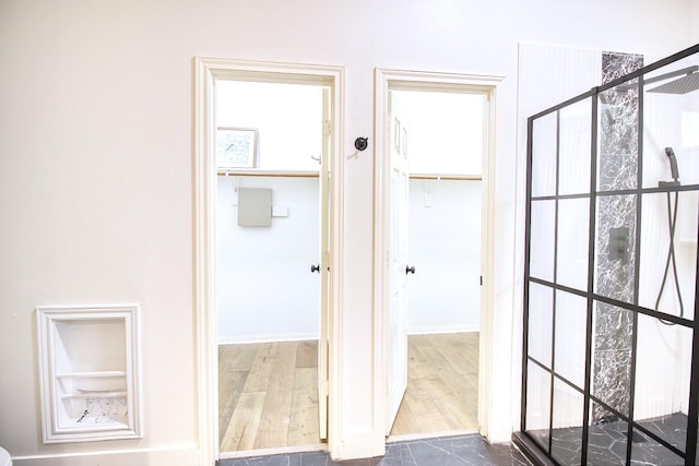 corridor featuring dark wood finished floors