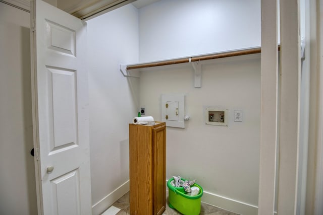 clothes washing area with laundry area, hookup for a washing machine, baseboards, and hookup for an electric dryer