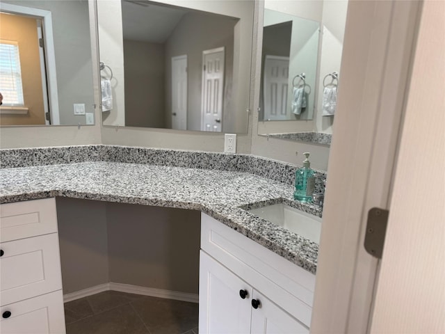 bathroom with vanity and tile patterned floors