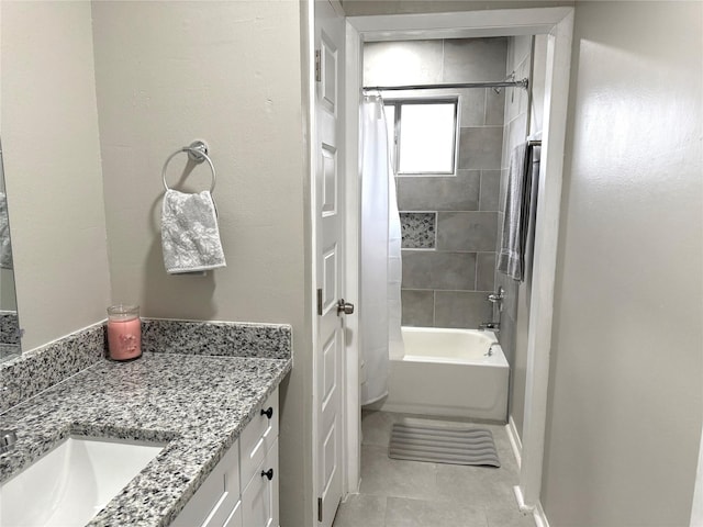 full bath featuring shower / bath combo with shower curtain, vanity, and tile patterned floors