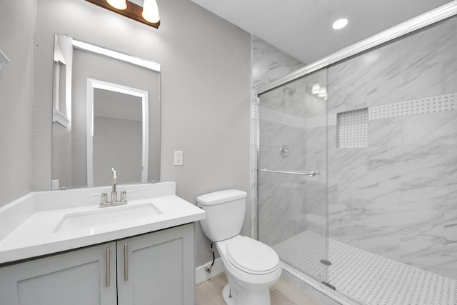 full bathroom with toilet, recessed lighting, a marble finish shower, and vanity