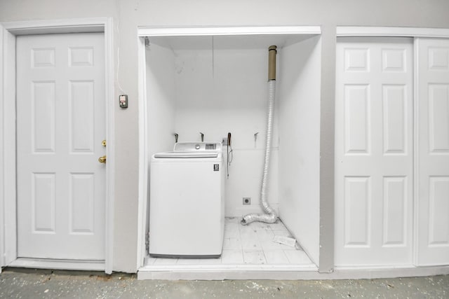 washroom featuring laundry area and washer / clothes dryer