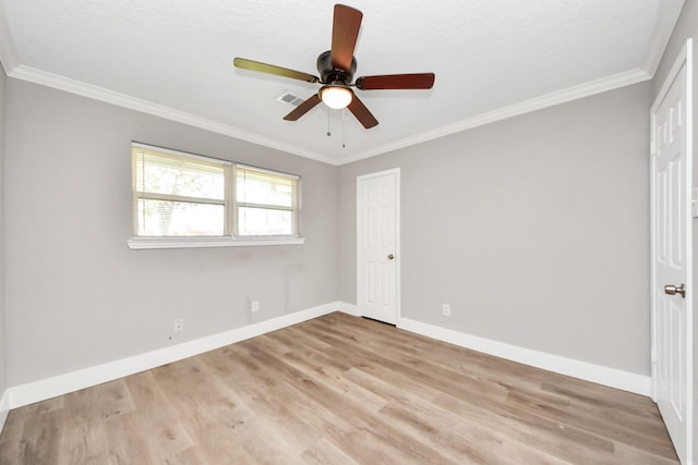 unfurnished bedroom with light wood-style floors, baseboards, a ceiling fan, and ornamental molding