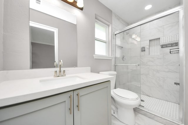 full bath featuring toilet, marble finish floor, a shower stall, and vanity