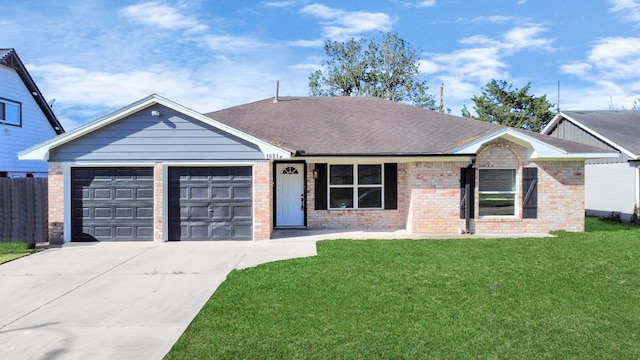 ranch-style house featuring a garage, a shingled roof, concrete driveway, a front yard, and brick siding