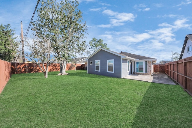 view of yard with a patio and a fenced backyard