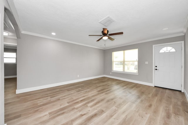 foyer featuring light wood finished floors, a ceiling fan, visible vents, and baseboards