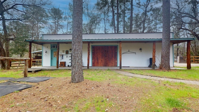 view of front of house with metal roof