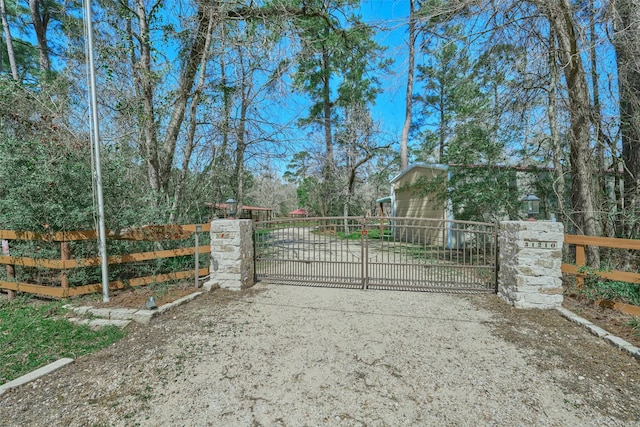 view of gate featuring fence