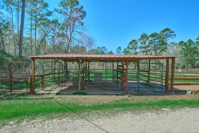 view of property's community featuring an outbuilding and an exterior structure