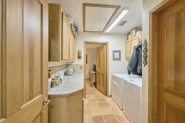 washroom with washer and clothes dryer, visible vents, cabinet space, and attic access