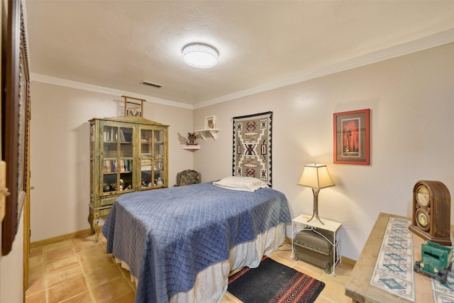 bedroom with visible vents, baseboards, and ornamental molding