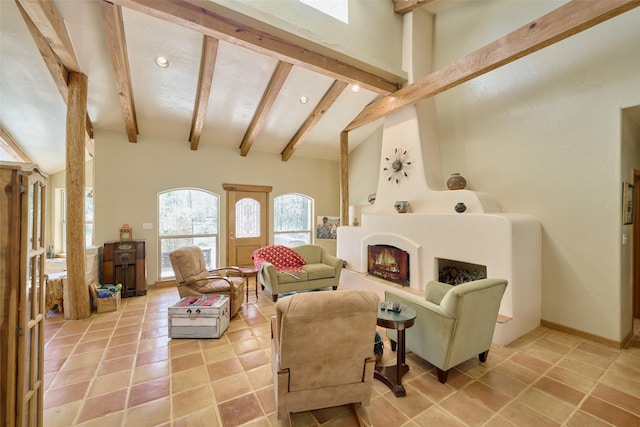 living area featuring beam ceiling, high vaulted ceiling, recessed lighting, and a large fireplace