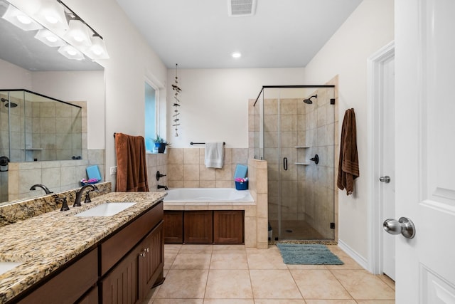 bathroom with visible vents, tile patterned floors, vanity, a shower stall, and a bath