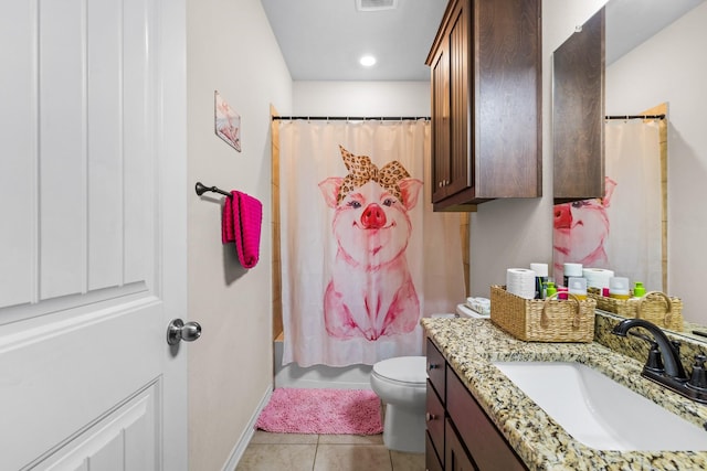 bathroom with visible vents, baseboards, toilet, tile patterned flooring, and vanity