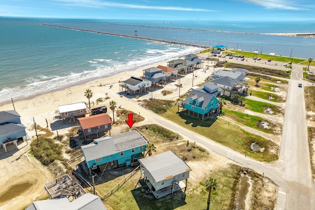 bird's eye view with a water view and a view of the beach