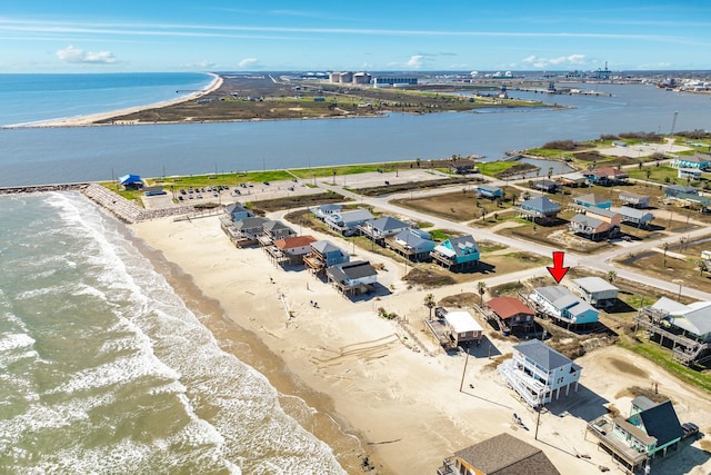 bird's eye view with a beach view and a water view