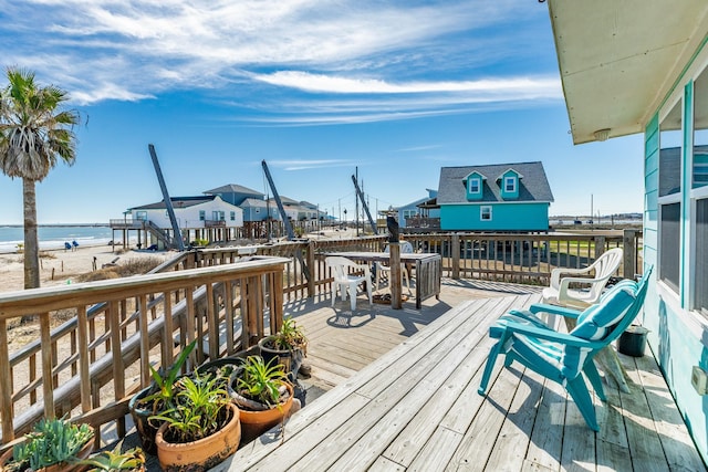 wooden terrace with a water view